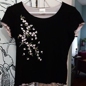 Black short sleeved top with white flower detail